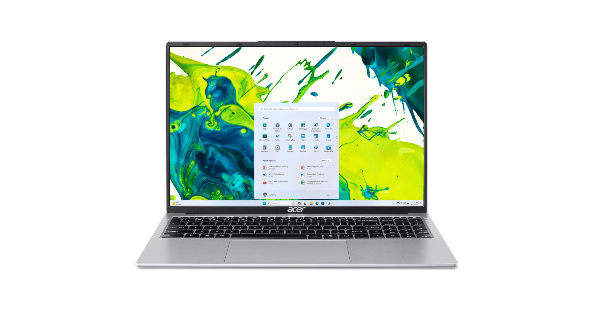 Acer laptop open to a colorful abstract wallpaper with the Windows desktop and taskbar showing on screen, viewed from the front