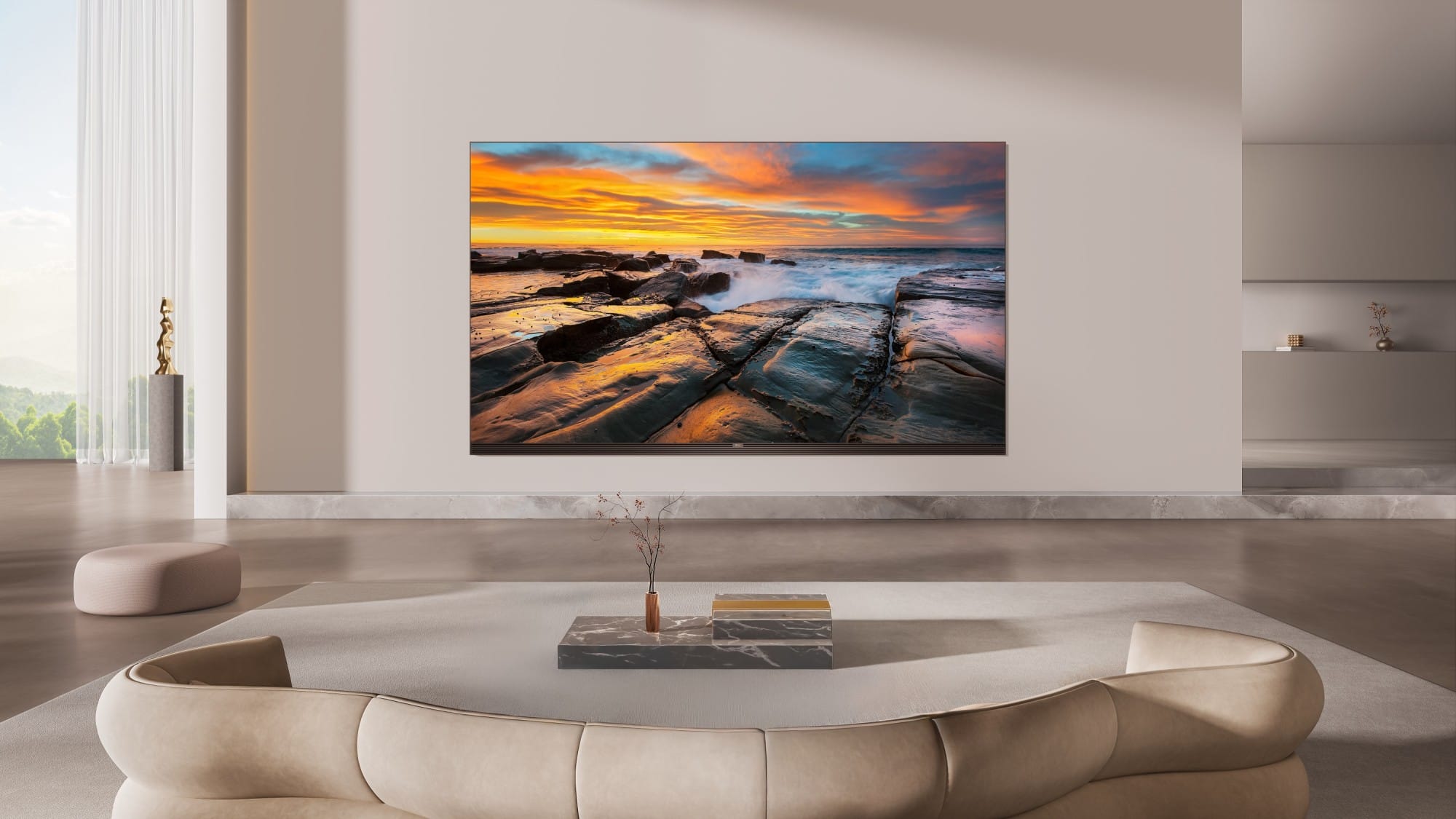Modern living room with a large sunset shoreline photo on the wall above a circular beige sofa.