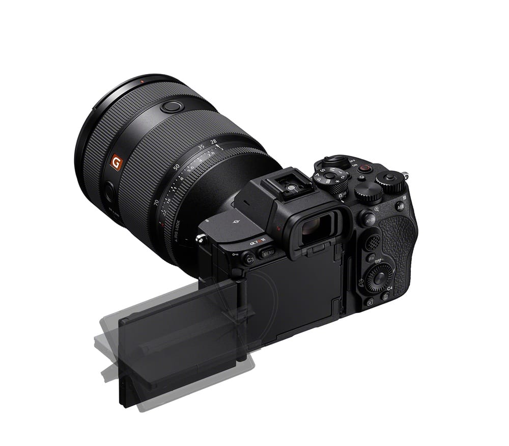 Black digital camera with a long zoom lens and a flip-out LCD screen extended from the back.