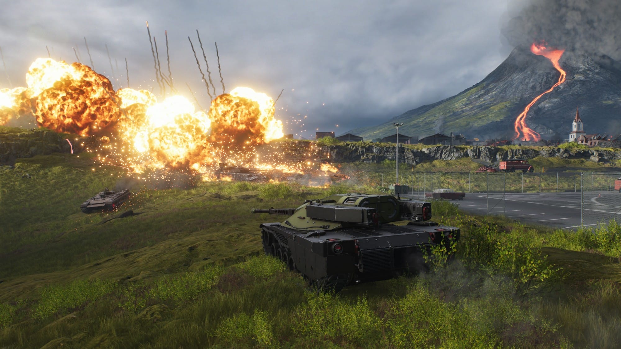 War scene with several tanks on grassy terrain as explosions erupt on the left, smoke rising across a valley.