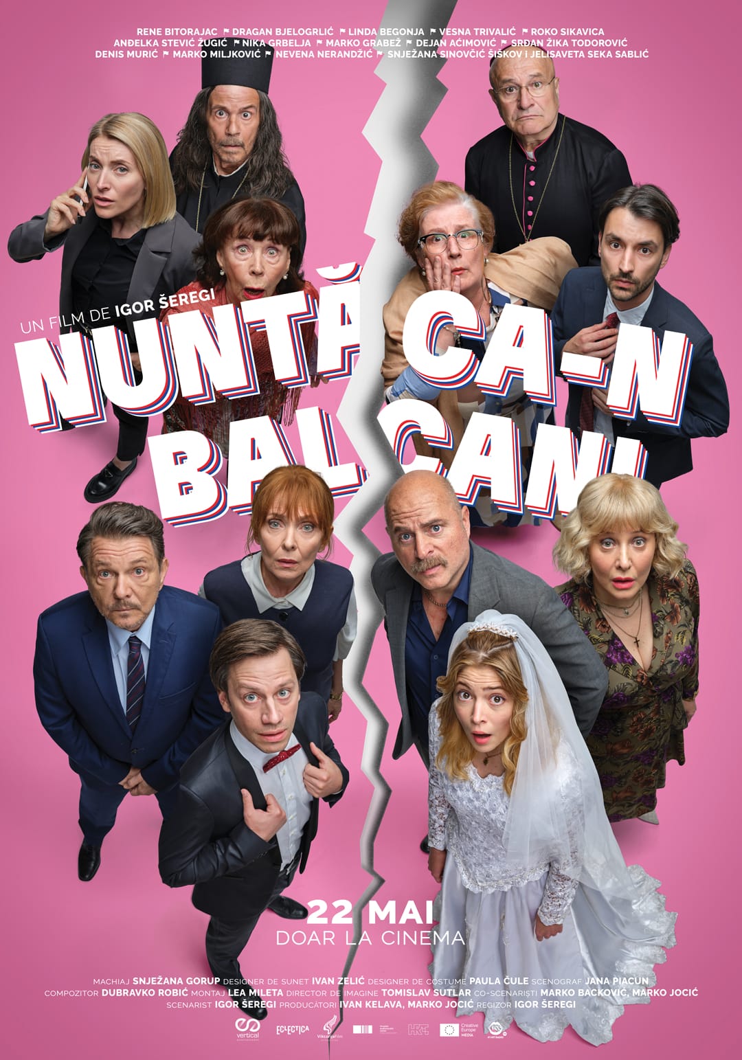 Poster for a film with a pink background, a jagged white crack splitting the image in two, a group of actors looking up toward the viewer, and bold white letters with red/blue outlines spelling the title across the center; a bride in a wedding dress appears at the bottom right, and a date line near the bottom says 22 MAI.